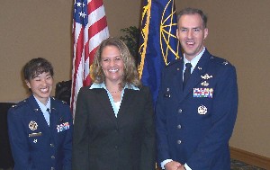 The annual awards luncheon presentation team in March includes (l-r) Col. Donna Rogers, USAF (l), Armed Forces Technical Applications Center (AFTAC); Heidi Hughes, chapter president; and Col. Bernie Gruber, USAF, 45th Operations Group.
